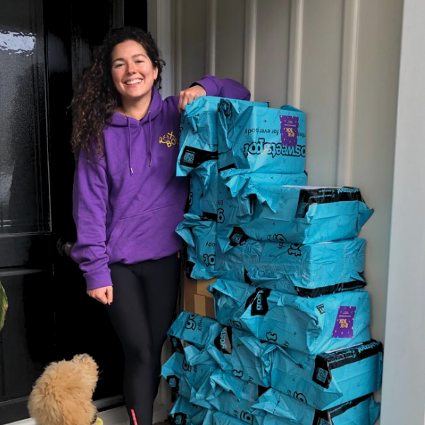 Fiona nagy stands next to a pile of roxbox crystal mining bucket orders